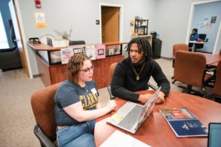 A student meets with an academic advisor in the Academic Support Center.