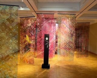 Display of silk and organza panels dyed by artist Christopher Schulte