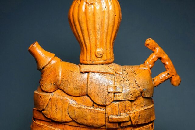 Orange ceramic sculpture by Troy Aiken.