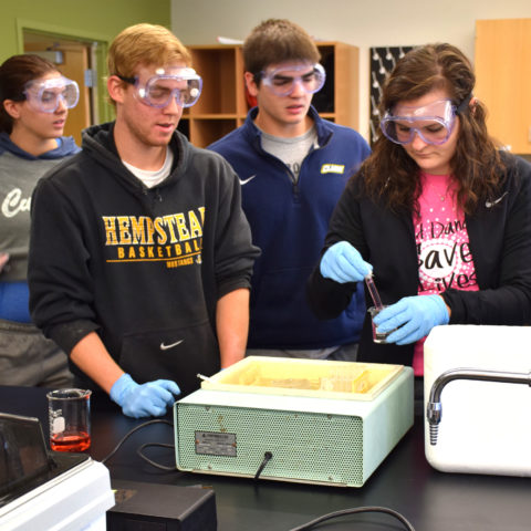 Students completing lab work as part of Clarke University Chemistry Degree Program