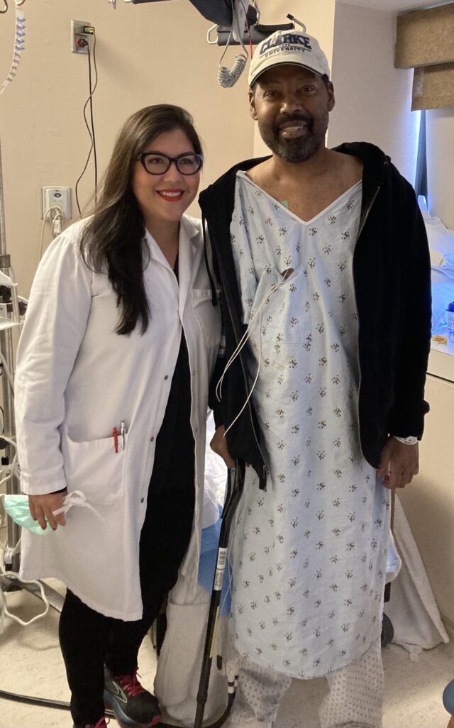 Garland (right) poses with his surgeon following his double lung and kidney transplants.