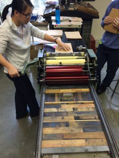 Students work on press printers