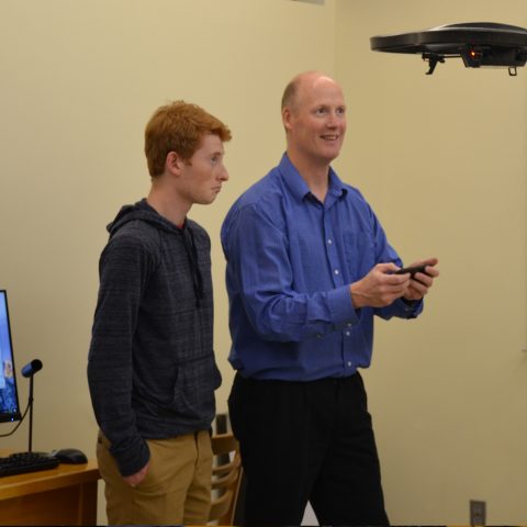 Computer Information Systems Degree Students working with a Drone