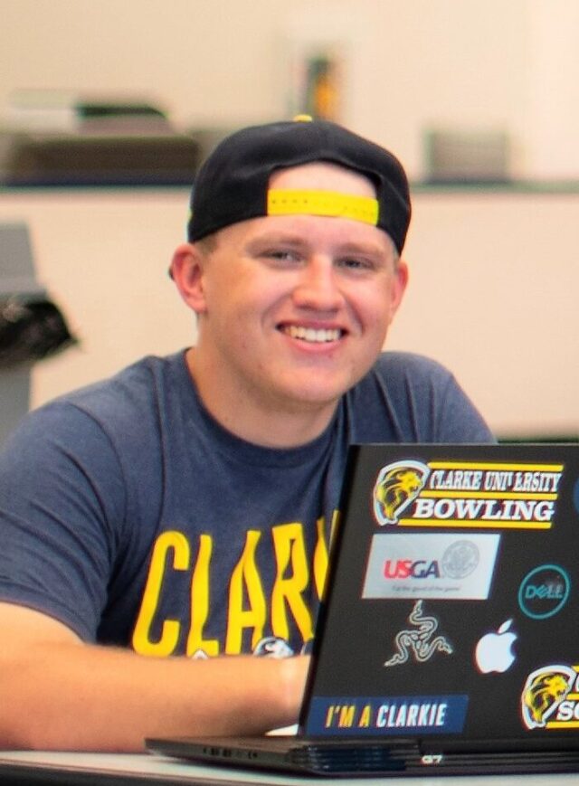 Clarke University History Degree student typing a paper - Clarke University  - Clarke University