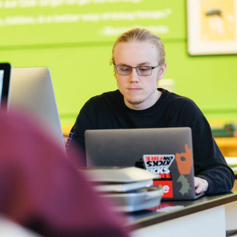 Clarke Communications Major in lab working on project