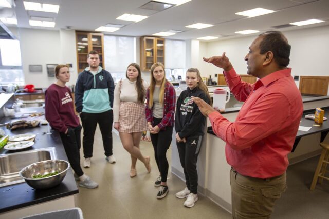 students and faculty in food science lab