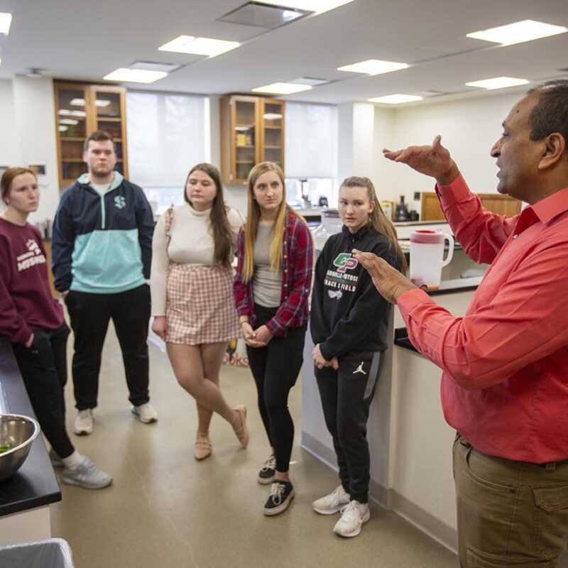 students and faculty in food science lab