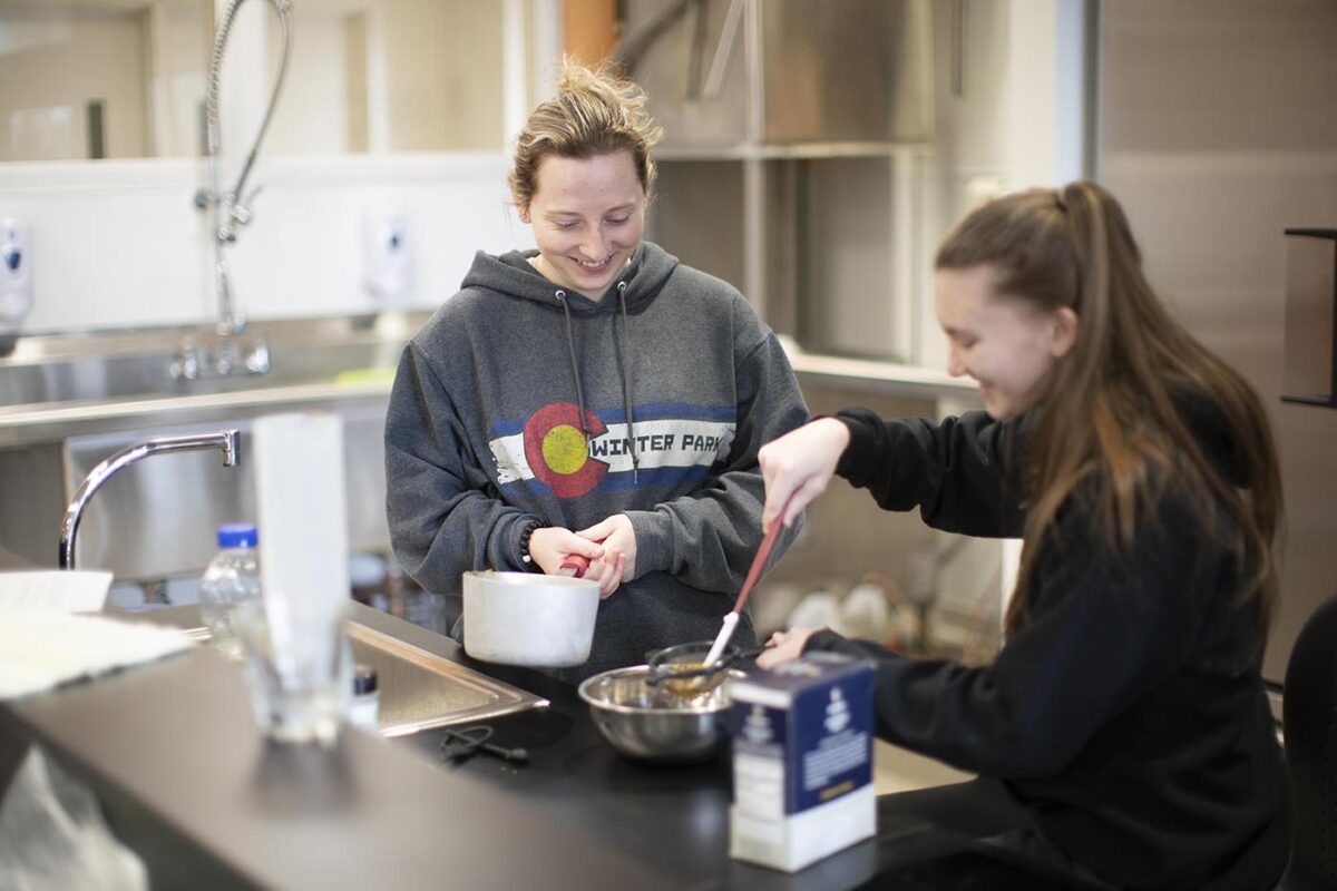student and faculty working in food science lab - Full Size