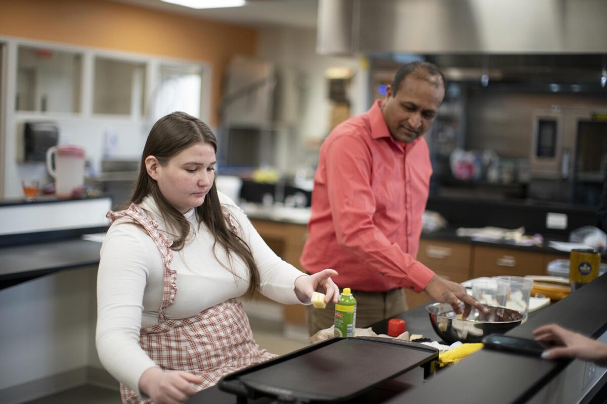 student and faculty working in food science lab - Full Size