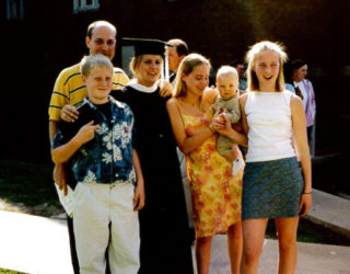 Graduation photo of a family.