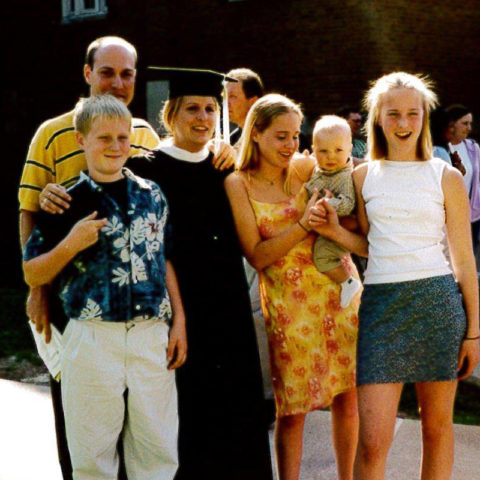 Graduation photo of a family.